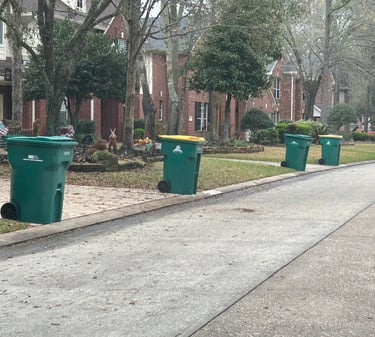 Trash and recycling bins rolled to the curb by Trash Can Caddie in The Woodlands TX