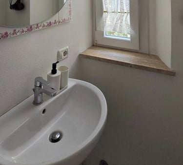 a bathroom sink with a mirror and a mirror