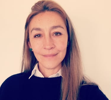 Professional psychologist smiling for a photo in formal wear