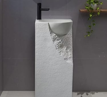 a bathroom with a sink and a plant in the background