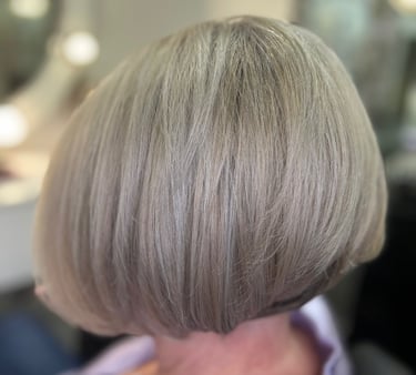 a woman with a short blonde bobble haircut