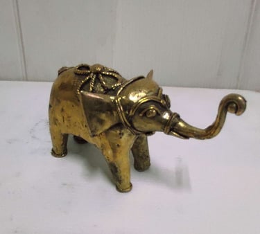 "Glossy brass baby elephant with tribal design carvings, right side view-for foreign markets"