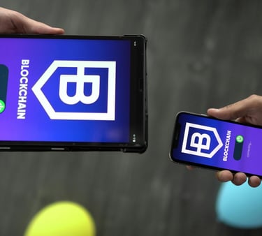 Tablet and Smartphone with "Blockchain" Appearing on Screens