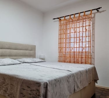 Quiet bedroom with double bed and orange curtains, Easy Living, Lokva Rogoznica