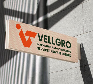 Vellgro Marketing and Consulting Services logo on a modern outdoor office building sign.