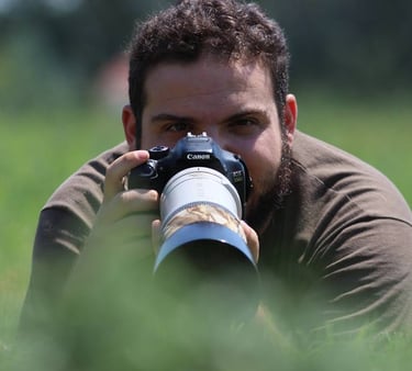 a man taking photo with telephoto lens