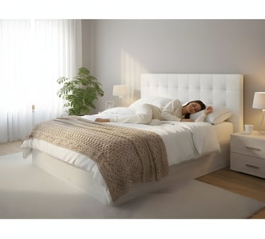 a woman laying on her bed in a bedroom