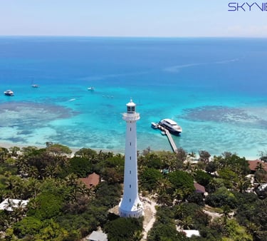 a lighthouse in the middle of a body of water