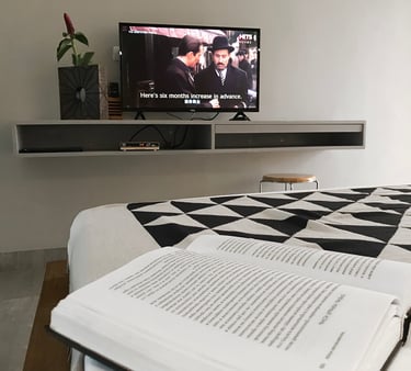 a book is sitting on a bed with a book and a book