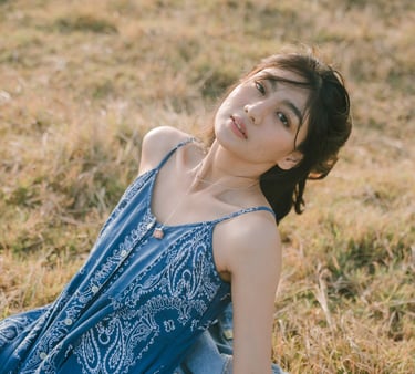 Editorial portrait in natural grass field near Pantai Nyanyi Tabanan Bali