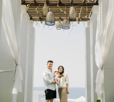 Family portrait beneath the signature corridor at Samabe Bali Suites & Villas in Nusa Dua.