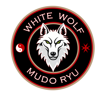 White Wolf Mudo Ryu martial arts logo featuring a white wolf head with green eyes inside a black circle.