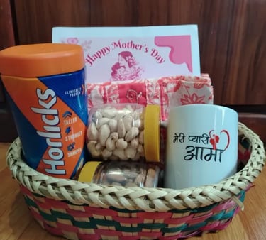 Mother's Day gift basket with Horlicks, nuts, and a personalized ceramic mug in a woven hamper.