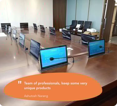 Multiple monitor lifts installed at a customer location in a corporate setting.