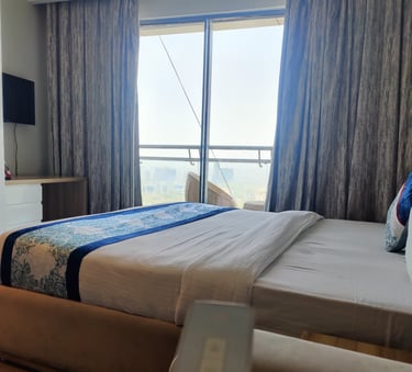 Image of a clean and comfortable bed inside a luxury apartment