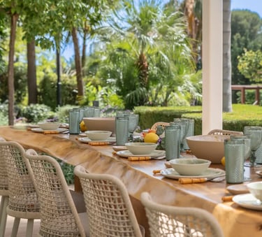 Al fresco dining terrace with wicker chairs at Villa Serenity