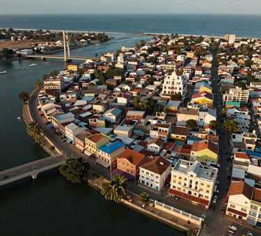Elegant aerial view of Dakar's coastline showcasing modern buildings and vibrant city life.