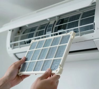 A close-up photograph of a clean, modern air conditioning filter being carefully inspected by a technician's hands, in a bright, professionally lit South American home setting, with soft muted blue and white tones.