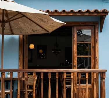 A split-view style architectural photograph of a high-end South American restaurant balcony. On one side, a worn ombrelone; on the other, a perfectly restored one in a sophisticated sky blue color with a sturdy wooden frame.