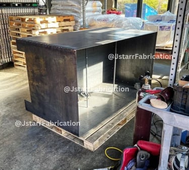 a unfinished metal planter box getting repaired