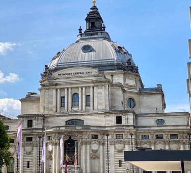 a large portland stone building with a dome shaped roof made of lead