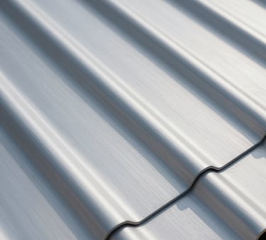 A detailed close-up of high-quality zinc roofing sheets with perfect professional seams. The lighting is crisp and natural, highlighting the metallic texture and robust construction. The composition is modern and clean, reflecting a professional craftsmanship vibe with a color palette including #455A64 and #90A4AE.