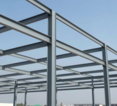 A professional wide-angle shot of a commercial steel structure under construction against a clear blue sky. The scene emphasizes robust professionalism and precision, incorporating tones of #2D3A3A and #A3B5B5.