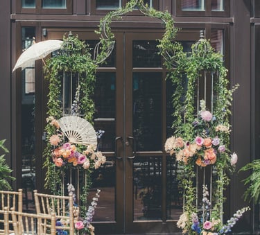 a wedding ceremony with umbrellas and umbrellas