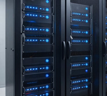 A high-tech server room with glowing blue and white lights on racks, representing advanced digital infrastructure and reliability, clean and minimalist composition, professional photography.