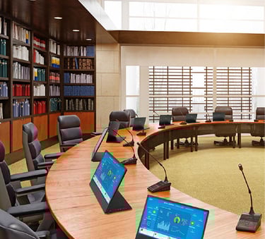 Conference microphone system and AV setup with PTZ cameras, dual displays, and professional audio routing for hybrid meetings