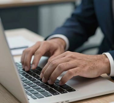 Close-up of hands typing a technical medical-legal report on a sleek laptop, a professional desk setting in a South American office, shallow depth of field, sharp focus, medium blue and white lighting.