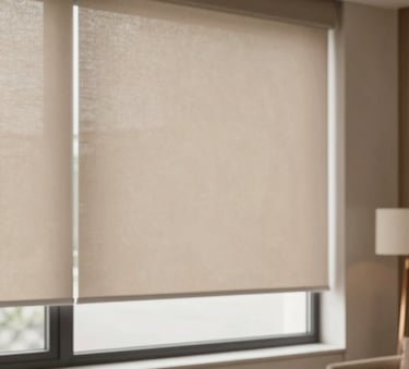 Sophisticated modern living room showcasing sleek motorized shades in a warm taupe fabric. The lighting is soft and airy, emphasizing the clean lines of the window treatments against a cream wall. Elegant Lora font vibes with subtle bronze accents in the decor.