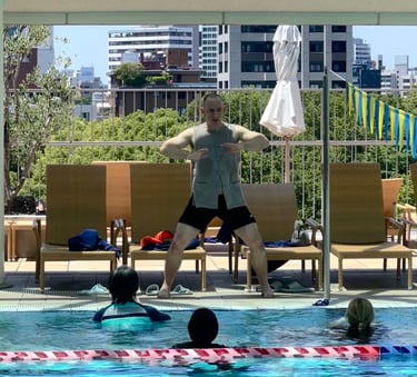 Aaron Bridge teaching Zen Shui Gong to Workshop attendees as Tokyo American Club Sky Pool