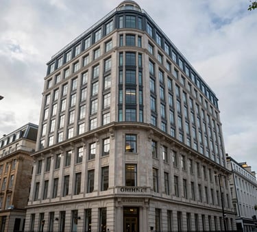 Exterior shot of a prestigious office building at 10 Grosvenor Street, London, featuring traditional British architecture with modern glass elements under a soft overcast sky, professional and sophisticated atmosphere.