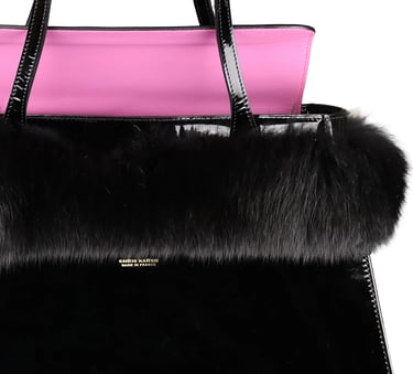 Luxury Chris Karch black patent leather tote bag with faux fur trim and pink lining.