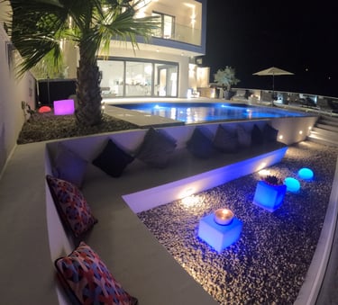 Villa Fay pool with a lounge area at night
