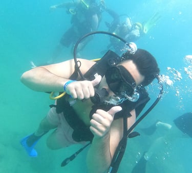 a man in a diving suit and scuba goggles