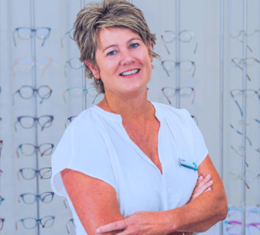 Juliet Clague Optical Consultant Smiling woman with shorth ash blonde hair blue eyes