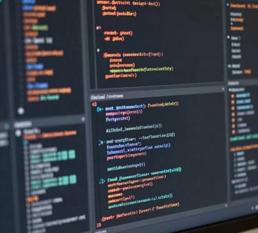 Close-up photography of a high-resolution monitor showing complex coding and AI data visualizations, reflective surfaces with charcoal gray and copper orange light accents, Global / Corporate.