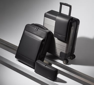 Targus black leather travel luggage set featuring a rolling suitcase, backpack, and tech pouch.