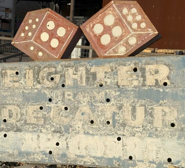 Vintage eighter from Decatur sign with red dice, blue background and white lettering
