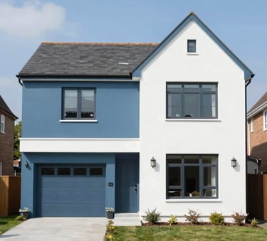 A wide shot of a modern Shrewsbury residence with freshly painted masonry in steel blue (#4E7D96) and crisp white (#F8FBFD). The finish is flawless, highlighting a clean, professional exterior under bright, natural daylight.