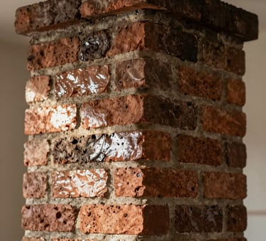 A close-up photograph of a meticulously cleaned brick chimney flue in a North American home, with light reflecting off the soot-free surface, professional and high-quality finish.