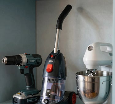 A collection of diverse high-quality household items including a high-end power drill, a steam cleaner, and a premium kitchen mixer, organized neatly on a light blue shelf in a South American home setting, soft natural lighting, photography emphasizing accessibility and quality.