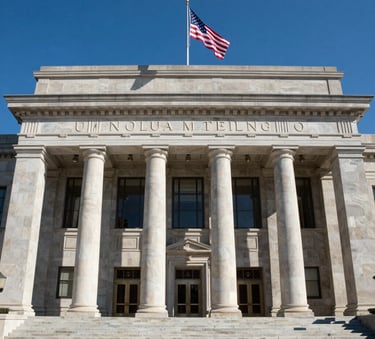 Architectural photography of a prestigious courthouse entrance with stone pillars and a North American flag, clear blue sky, professional and authoritative atmosphere, high contrast and clean lines.