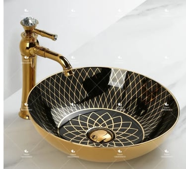 a bathroom sink with a gold sink and a faucet faucet