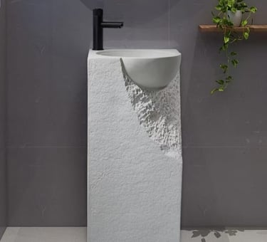 a bathroom with a sink and a plant in the background