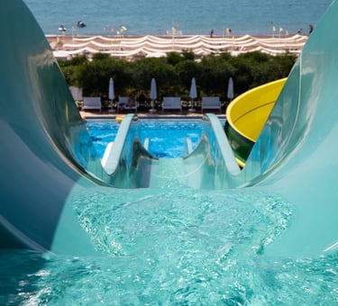 a pov view of a waterslide with flowing water