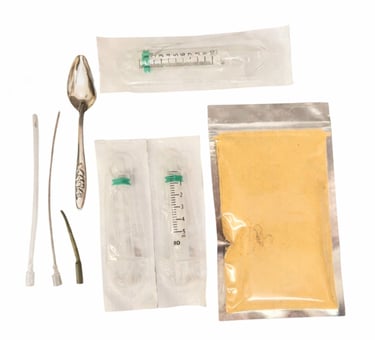 baby bird feeding formula in foil pouch with syringes and crop tubes and spoon
