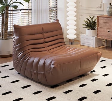 Fauteuil design en cuir marron confortable pour coin lecture ou salon chic